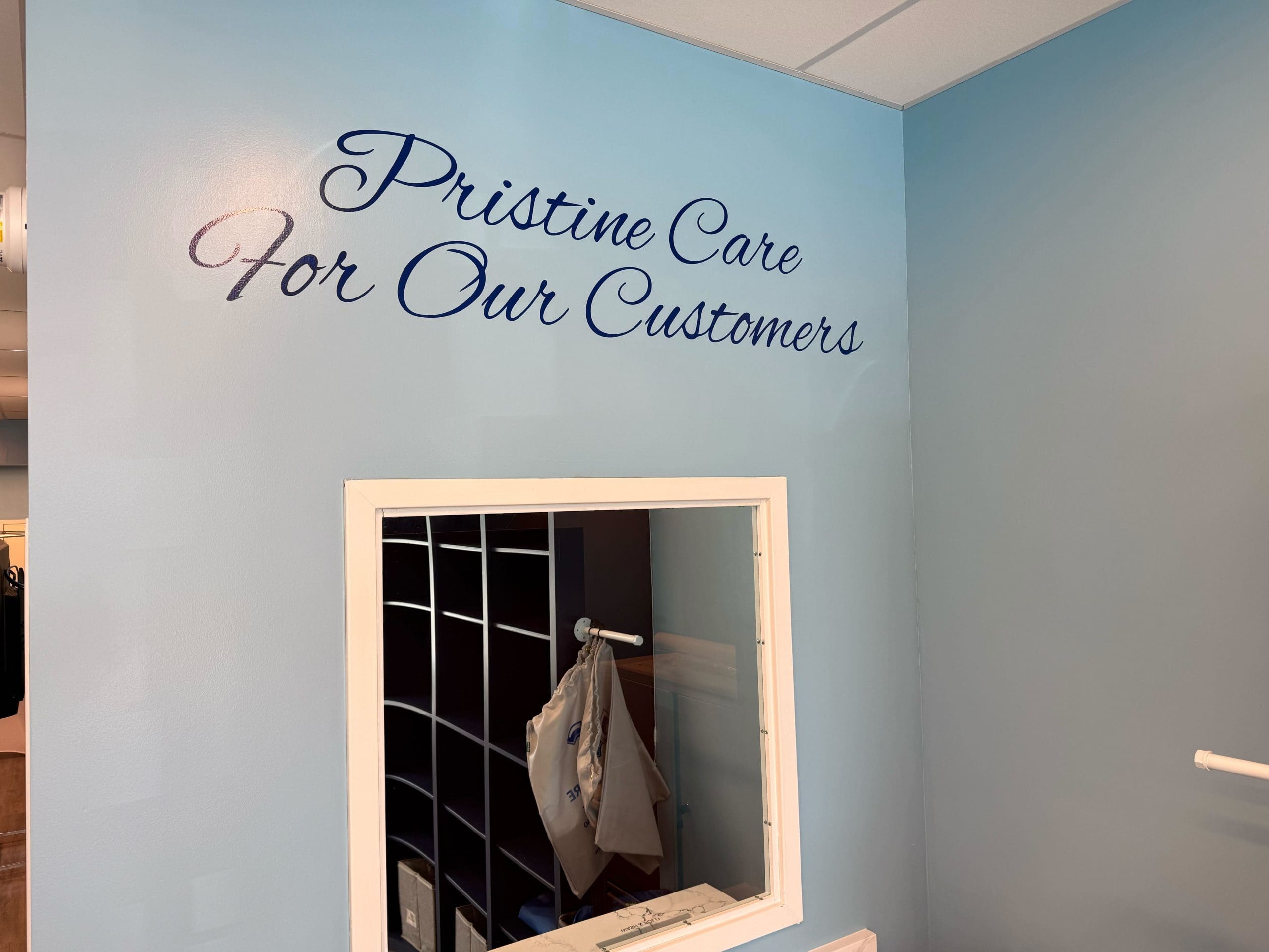 A light blue wall with the words 